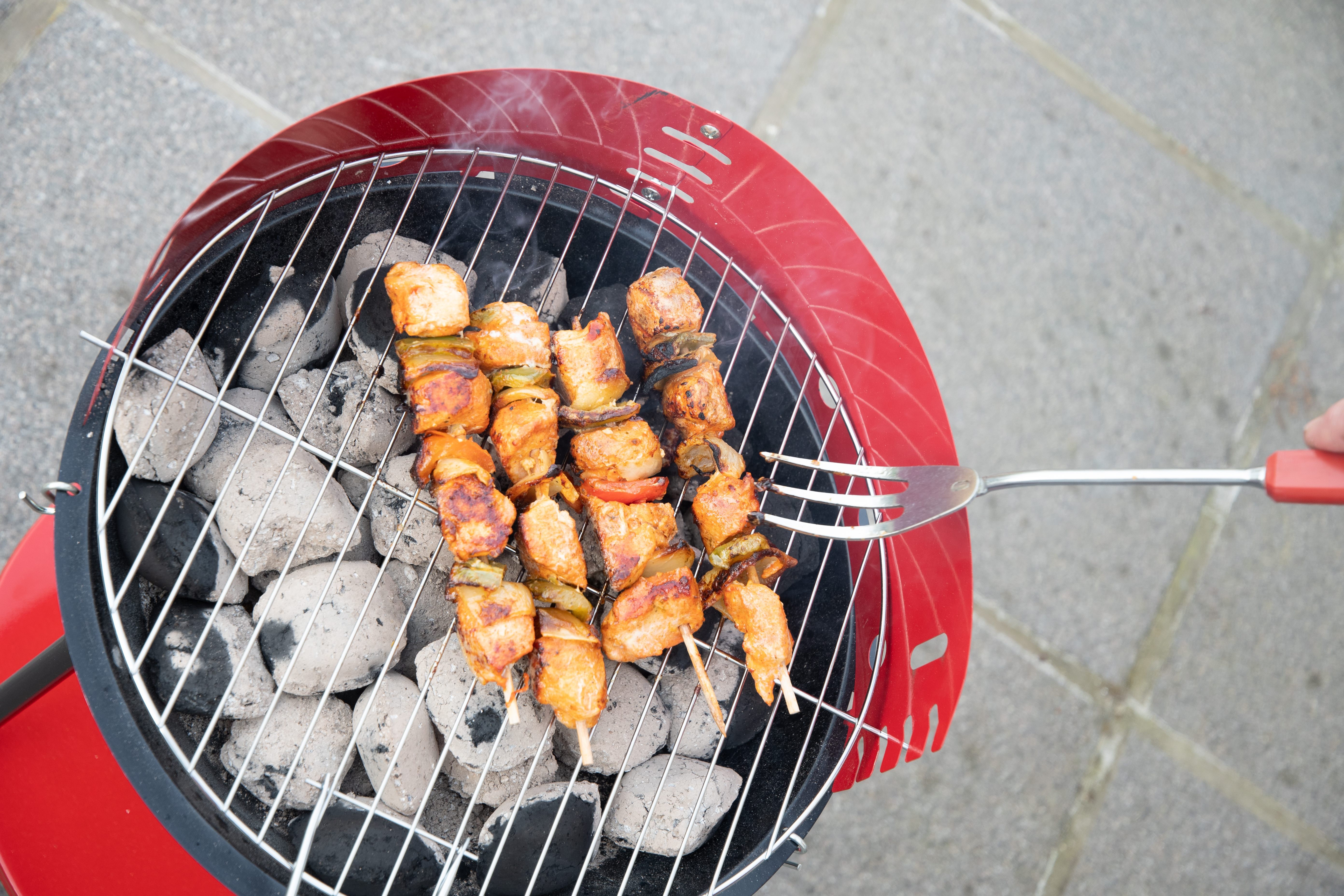 Man Flipping Chicken Skewers On Barbecue Grill Ove 2025 03 11 03 28 25 Utc