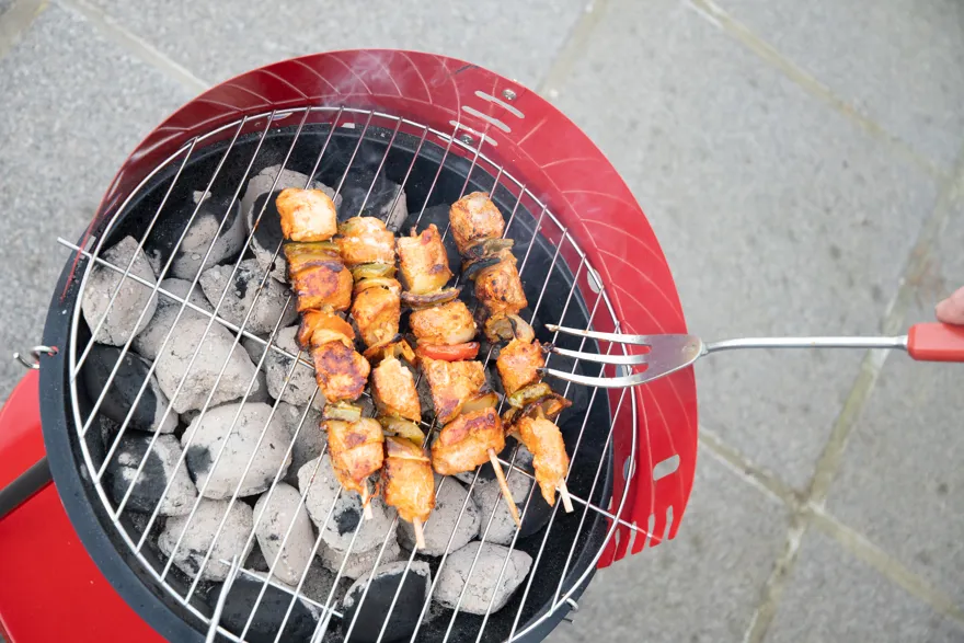 Man Flipping Chicken Skewers On Barbecue Grill Ove 2025 03 11 03 28 25 Utc